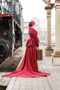 Rear view of woman standing in city