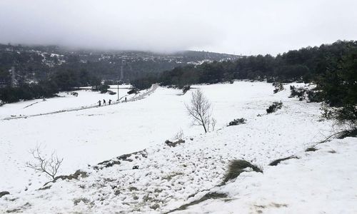 Scenic view of frozen landscape against sky