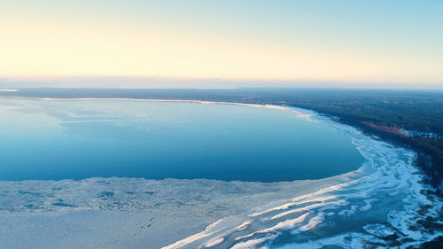 Scenic view of sea against sky during winter