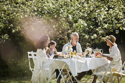 Group of people sitting on table