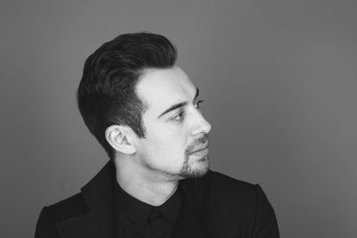 Portrait of young man against white background