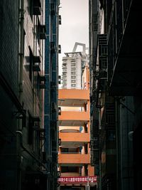 Low angle view of buildings in city against sky