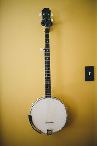 String instrument hanging on wall