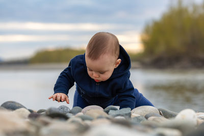 Portrait of boy standing at beach