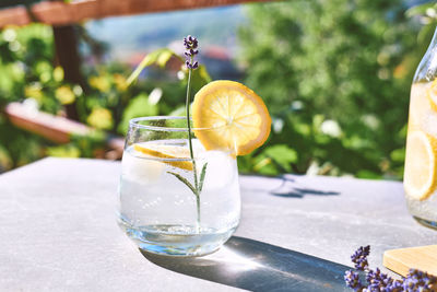 Cool lavender homemade lemonade with lemon slices and lavender flower. detox summer drink.