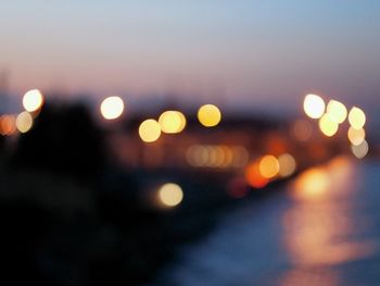 Defocused image of illuminated lights at night