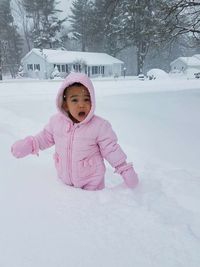 Portrait of girl playing on snow