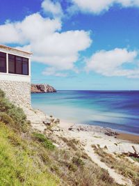 Scenic view of sea against cloudy sky