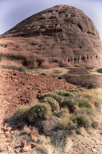 Scenic view of desert land against sky