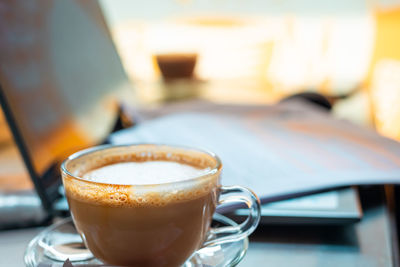 Close-up of coffee cup on table