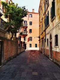 Footpath amidst buildings in town