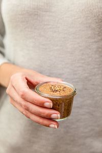 Woman holding coffee cup