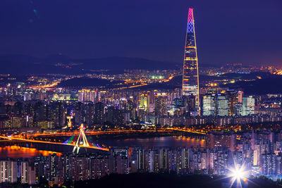 Illuminated buildings in city at night