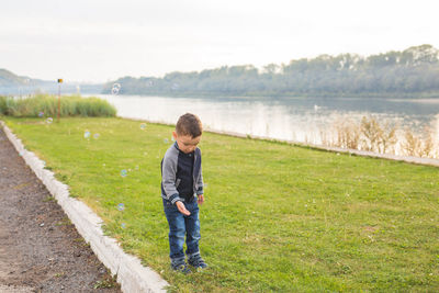 Full length of boy standing on land