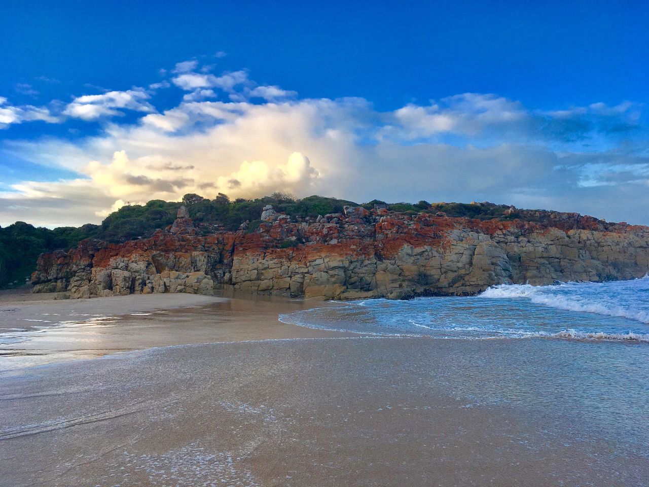 cloud - sky, multi colored, sky, sand, water, outdoors, beach, no people, nature, sunset, beauty in nature, flag, architecture, day