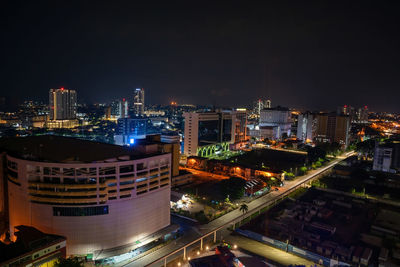 Panoramic view of city skyline, traffic and light by night. colourful city lights.