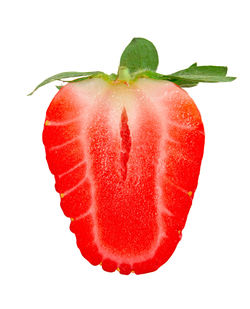 Close-up of strawberry over white background