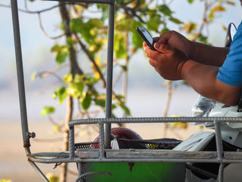 Close-up of man using mobile phone