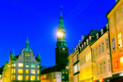 Close-up of city lit up at night