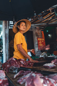 Woman wearing mask at market stall