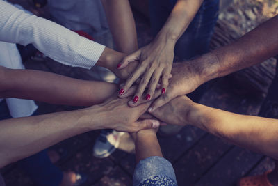 High angle view of people hands