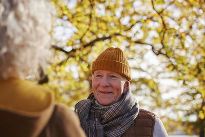 Smiling senior man looking away