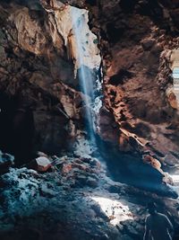 High angle view of waterfall in cave