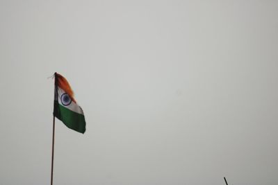 Low angle view of flag against clear sky