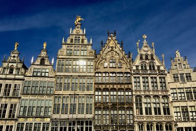 Low angle view of building against blue sky