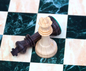 Close-up of chess pieces on floor