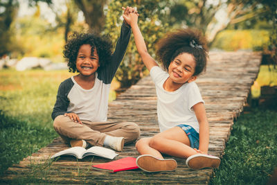 Portrait of a smiling girl sitting outdoors