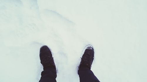 Low section of person against sky