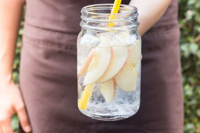 Close-up of woman holding drink