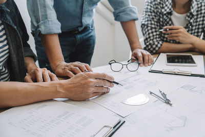 Group of people working on table
