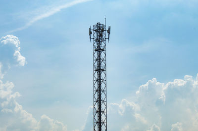 Low angle view of communications tower against sky