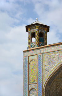 Low angle view of ornate building against sky