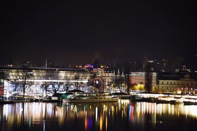 Reflection of illuminated buildings in water