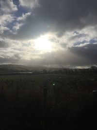 Scenic view of landscape against cloudy sky