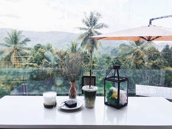 View of wine glass on table against window