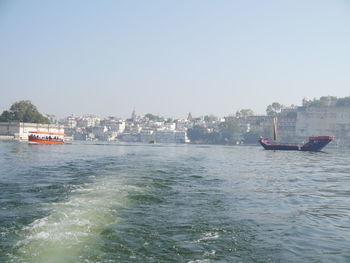 Nautical vessel on sea against clear sky