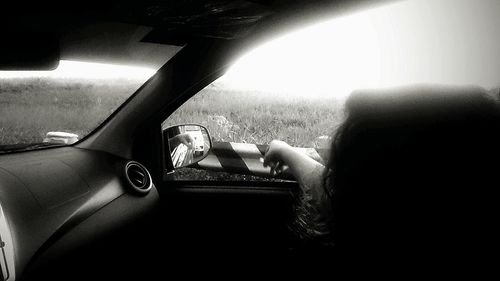 Woman looking through train window