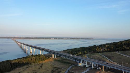 Bridge over sea against sky