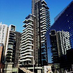 Low angle view of buildings against clear sky