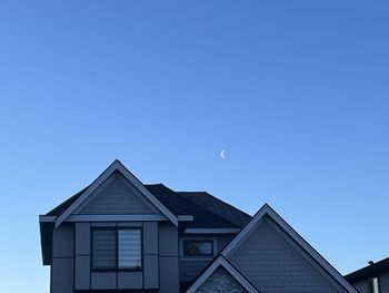 Low angle view of building against clear blue sky