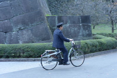 Man riding bicycle on street