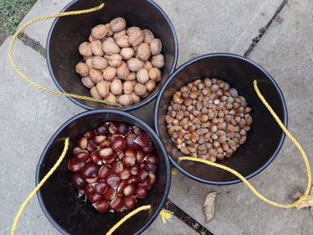 Directly above shot of various nuts in plastic buckets