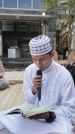Asian muslim man reading the holy koran