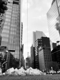 Low angle view of skyscrapers against sky