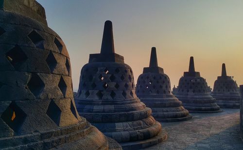 Stupas at borobudur against sky