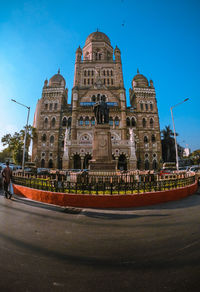 View of buildings against blue sky